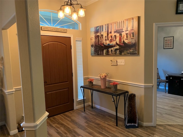 foyer with a chandelier and hardwood / wood-style flooring