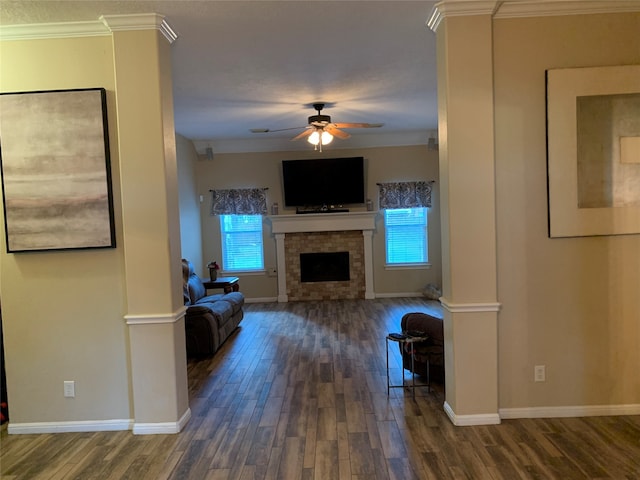 unfurnished living room with dark wood-type flooring, crown molding, and ceiling fan