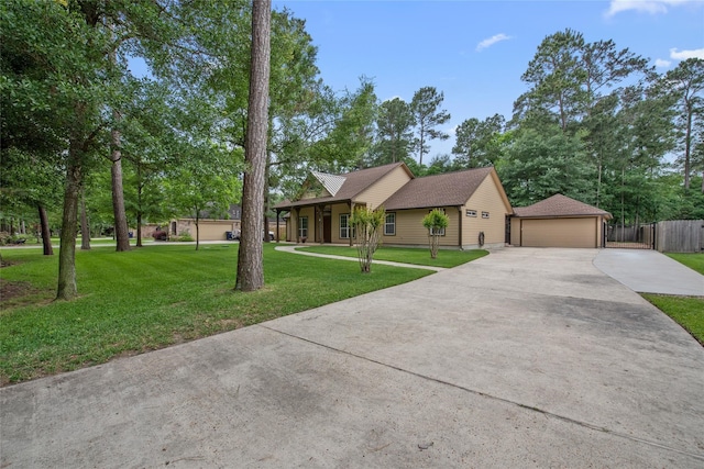 view of front facade with a garage and a front lawn