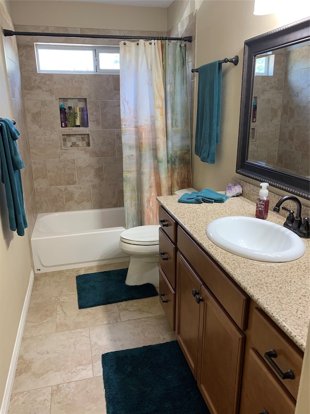 full bathroom with vanity, toilet, and shower / bath combo with shower curtain