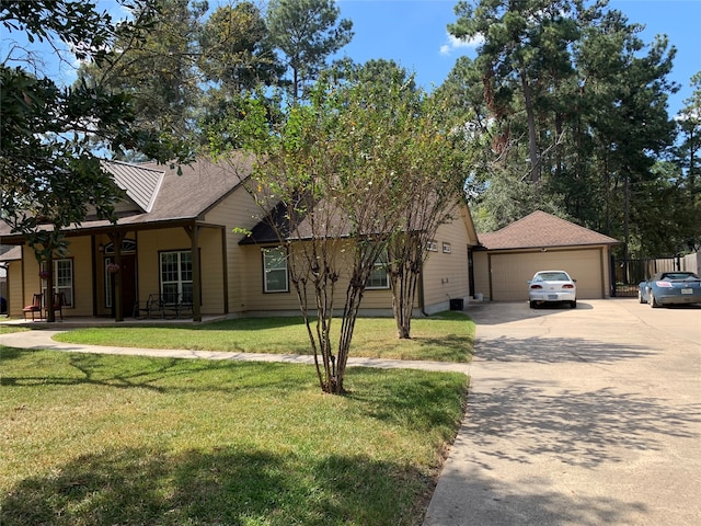 view of front of home with a front lawn and a garage