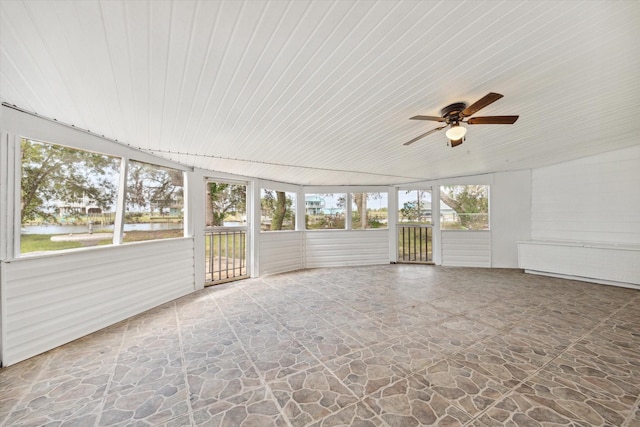 unfurnished sunroom with ceiling fan