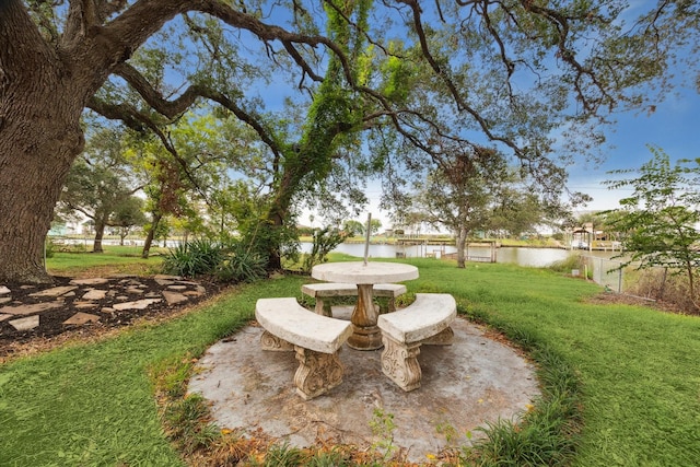 view of yard featuring a patio area and a water view