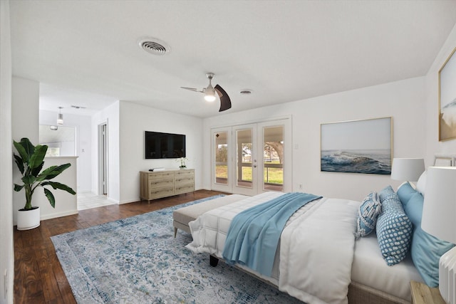 bedroom with ceiling fan, hardwood / wood-style flooring, visible vents, baseboards, and french doors