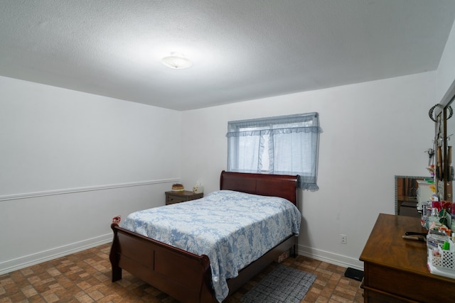 bedroom with a textured ceiling