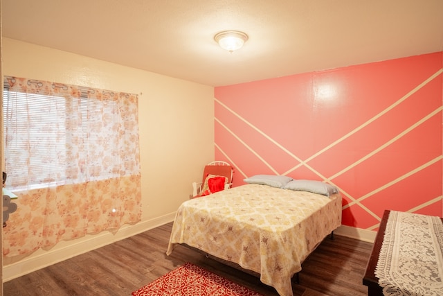 bedroom with hardwood / wood-style floors