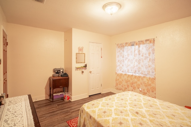 bedroom with hardwood / wood-style floors