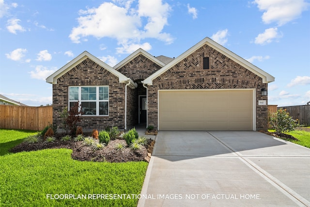 view of front of home featuring a front yard and a garage