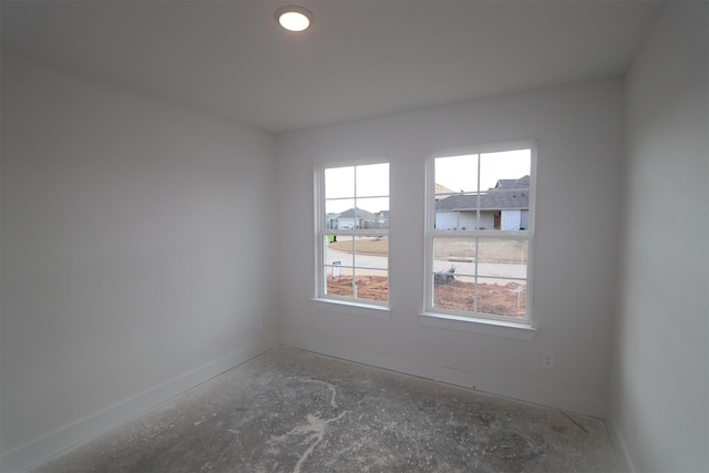 spare room featuring baseboards