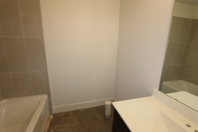 full bath with walk in shower, baseboards, a tub to relax in, and vanity