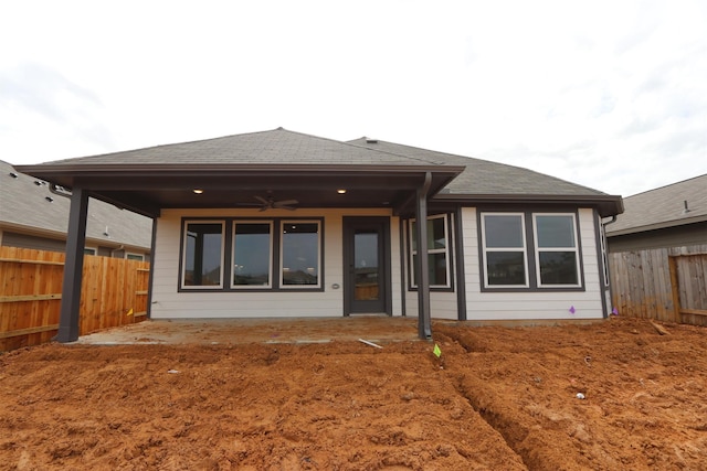 back of property featuring a patio area, a fenced backyard, a shingled roof, and ceiling fan