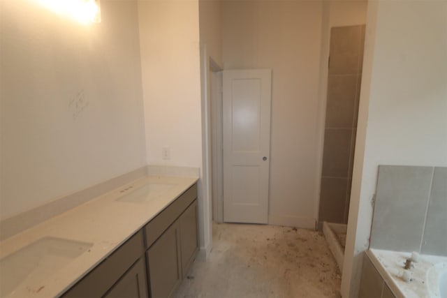 bathroom with a bathtub and vanity