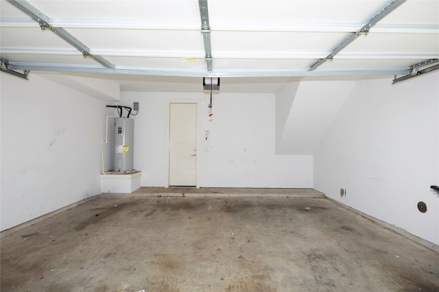 garage with a garage door opener and water heater