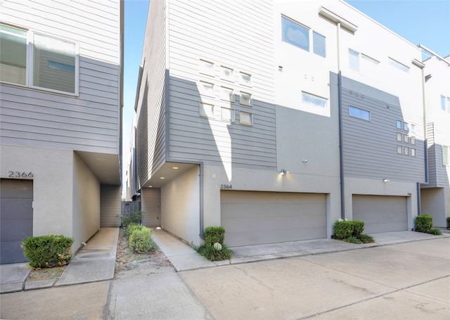 view of property exterior with a garage