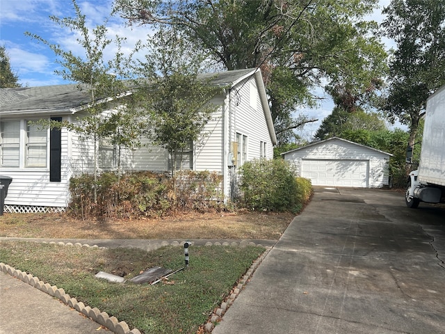 view of home's exterior featuring an outdoor structure and a garage