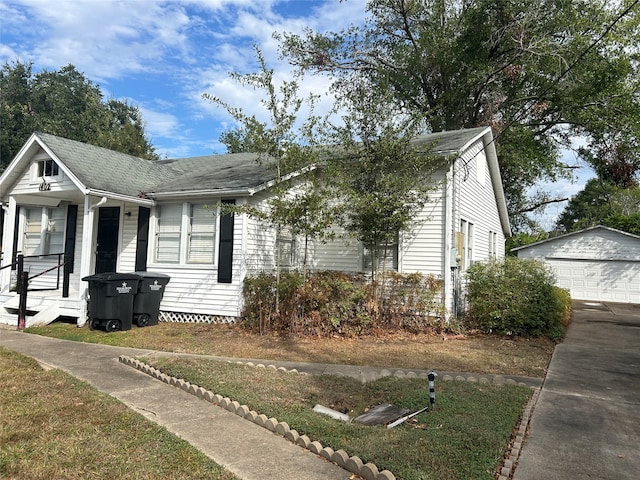 view of front of home with an outbuilding and a garage