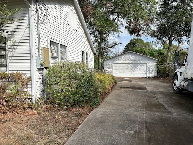 view of property exterior featuring an outbuilding and a garage