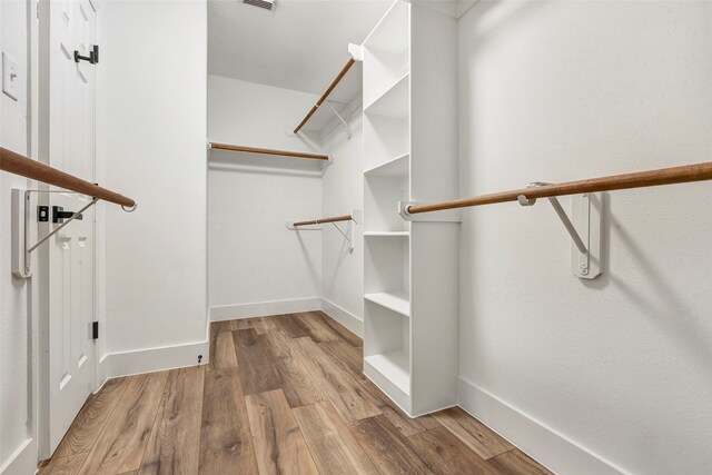 spacious closet with light wood-type flooring