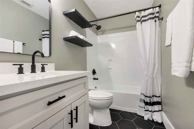 full bathroom featuring vanity, toilet, tile patterned floors, and shower / bathtub combination with curtain