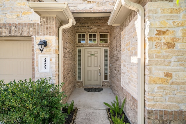 entrance to property featuring a garage