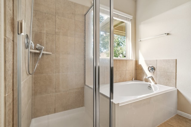 bathroom featuring independent shower and bath and tile patterned floors