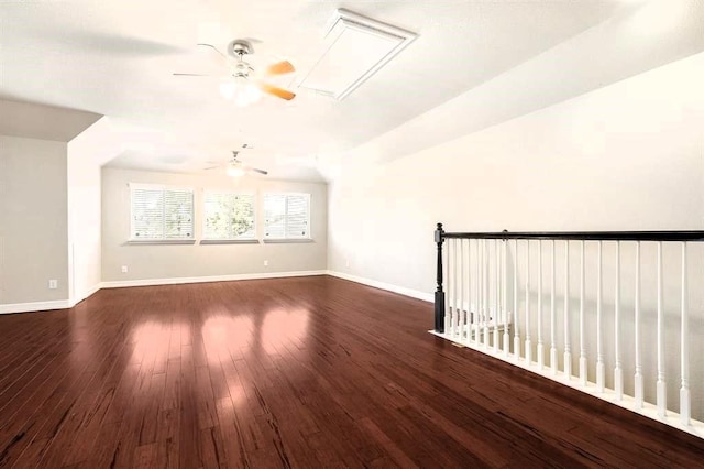 additional living space featuring ceiling fan, wood finished floors, and baseboards