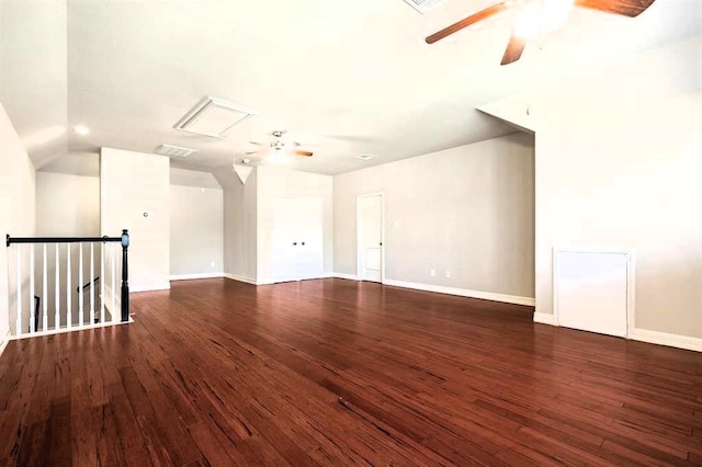 spare room featuring visible vents, wood finished floors, a ceiling fan, and baseboards