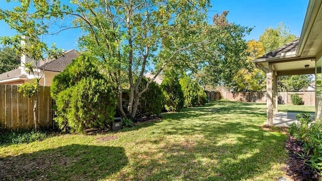 view of yard with a fenced backyard