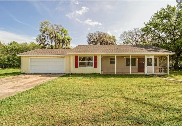 ranch-style home with a front yard and a garage