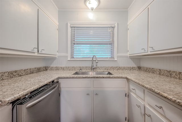 kitchen featuring crown molding, dishwasher, sink, and white cabinets