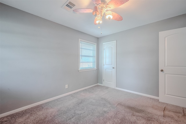 carpeted empty room with ceiling fan