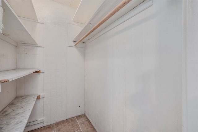 walk in closet featuring light tile patterned floors