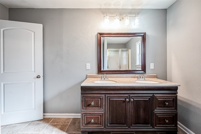 bathroom featuring vanity, tile patterned floors, and an enclosed shower