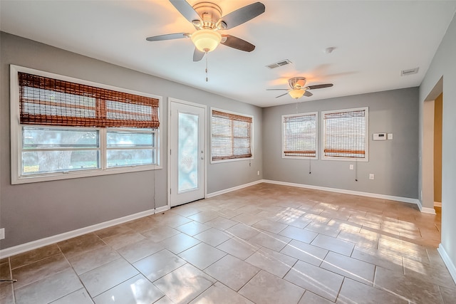 unfurnished room featuring light tile patterned flooring and ceiling fan