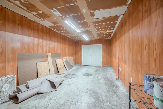 interior space featuring wooden walls