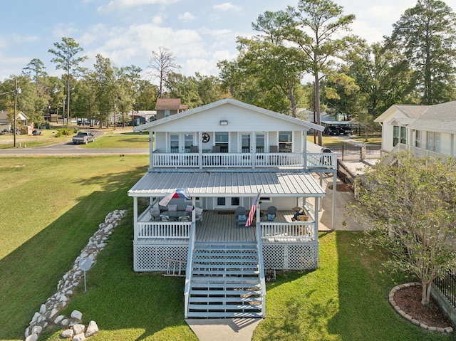 back of property featuring a wooden deck and a lawn