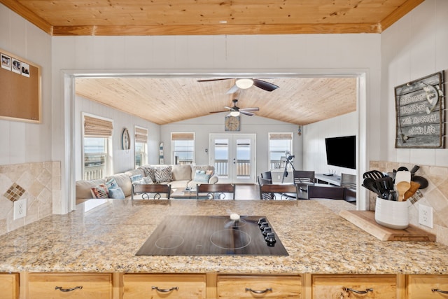 kitchen with light brown cabinets, lofted ceiling, and wood ceiling