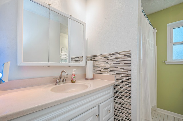 bathroom featuring tile patterned flooring and vanity