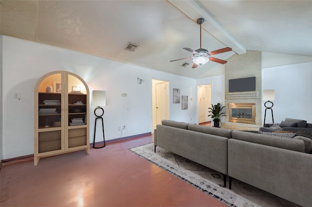 living room with lofted ceiling with beams, ceiling fan, and a fireplace