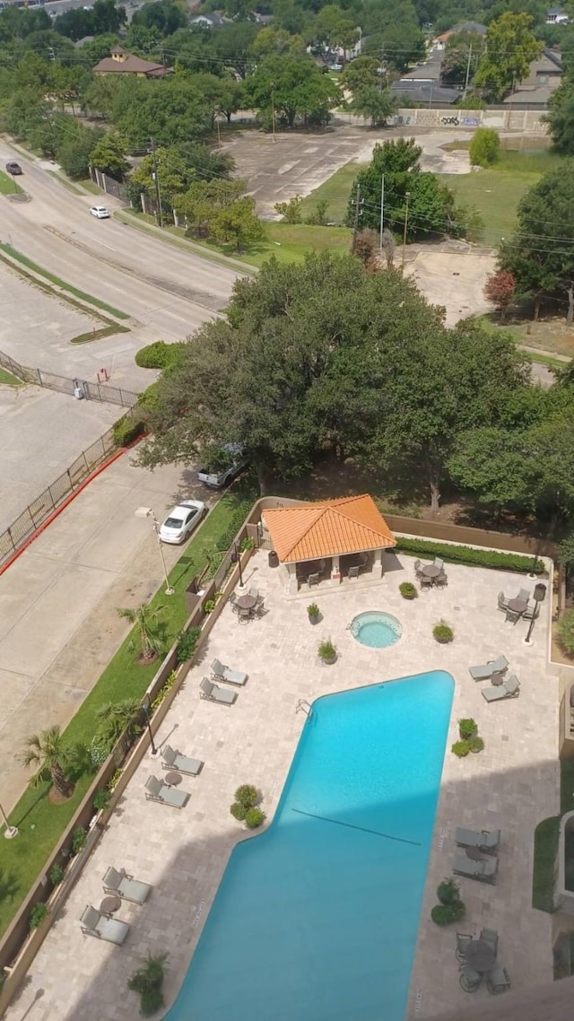 3525 Sage Rd Unit 1202, Houston, TX 77056 - aerial view of a pool and a tree filled landscape