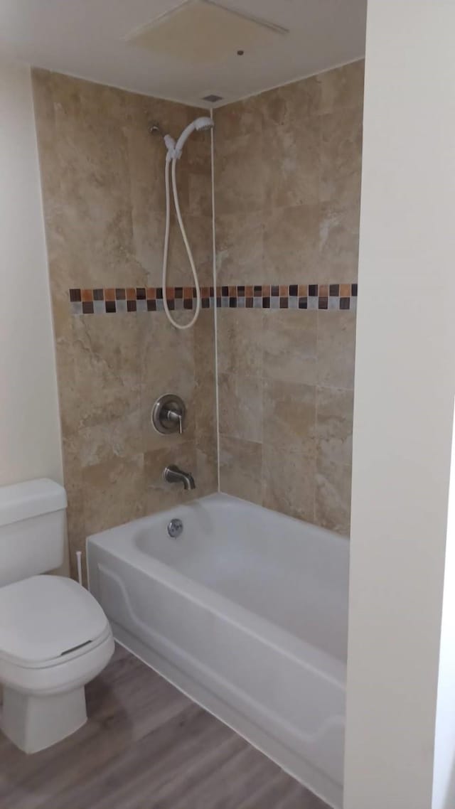 3525 Sage Rd Unit 1202, Houston, TX 77056 - full bathroom featuring washtub / shower combination and wood finished floors