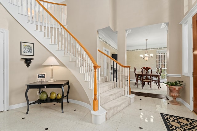 interior space with a towering ceiling and a notable chandelier