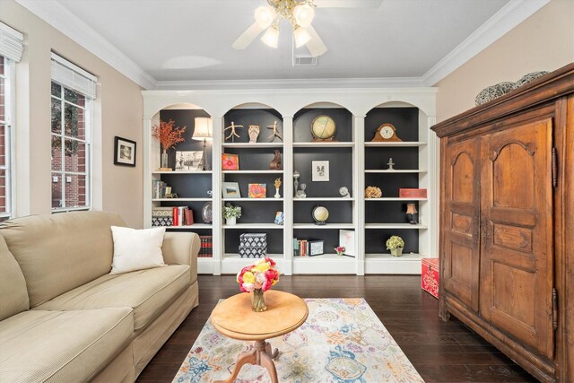 sitting room featuring crown molding, dark wood-type flooring, and ceiling fan