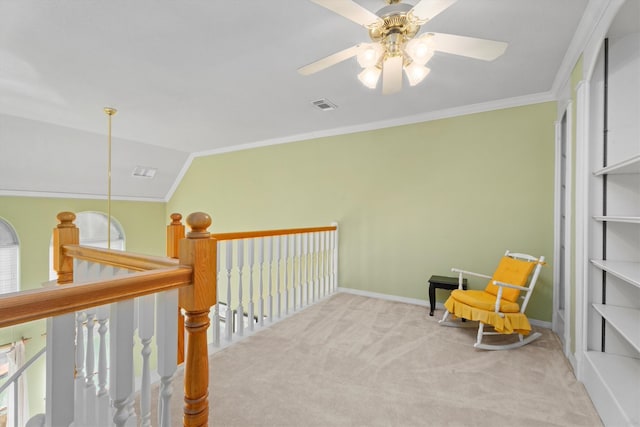 living area with vaulted ceiling, crown molding, and carpet floors