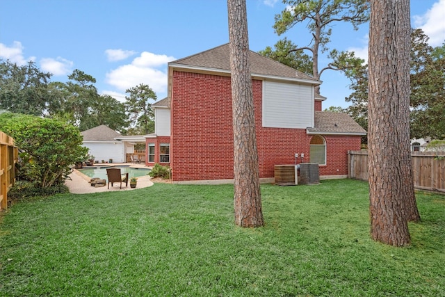 view of yard with a fenced in pool and a patio