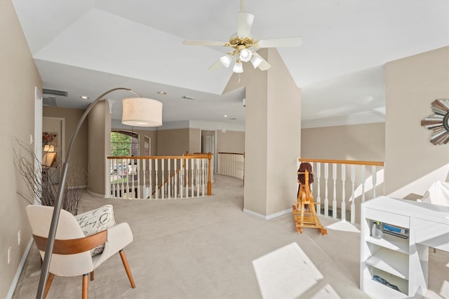 sitting room with ceiling fan and light colored carpet