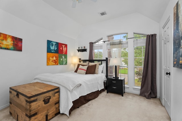 carpeted bedroom featuring ceiling fan and lofted ceiling