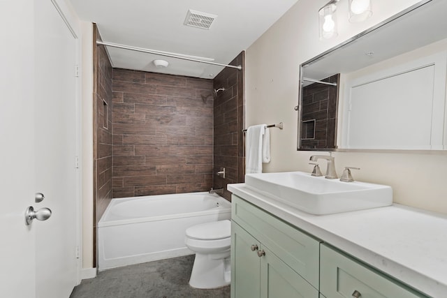 full bathroom featuring vanity, toilet, and tiled shower / bath