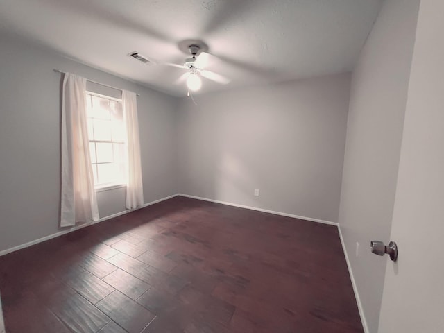 spare room with ceiling fan