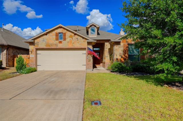 view of front facade with a garage and a front lawn